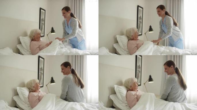 护理人员调整老年患者的毯子