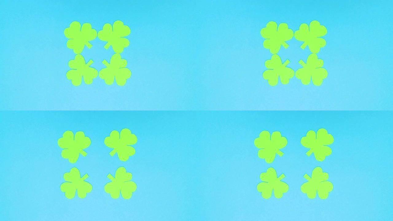 四只绿色丁香从蓝色背景的中心移动到边缘-停止运动