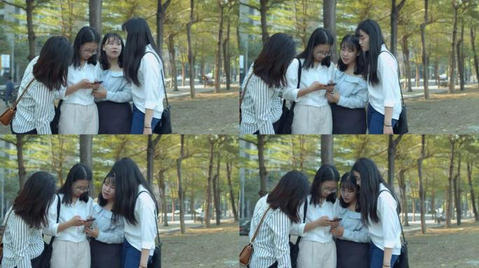 亚洲女子在公园聊天
