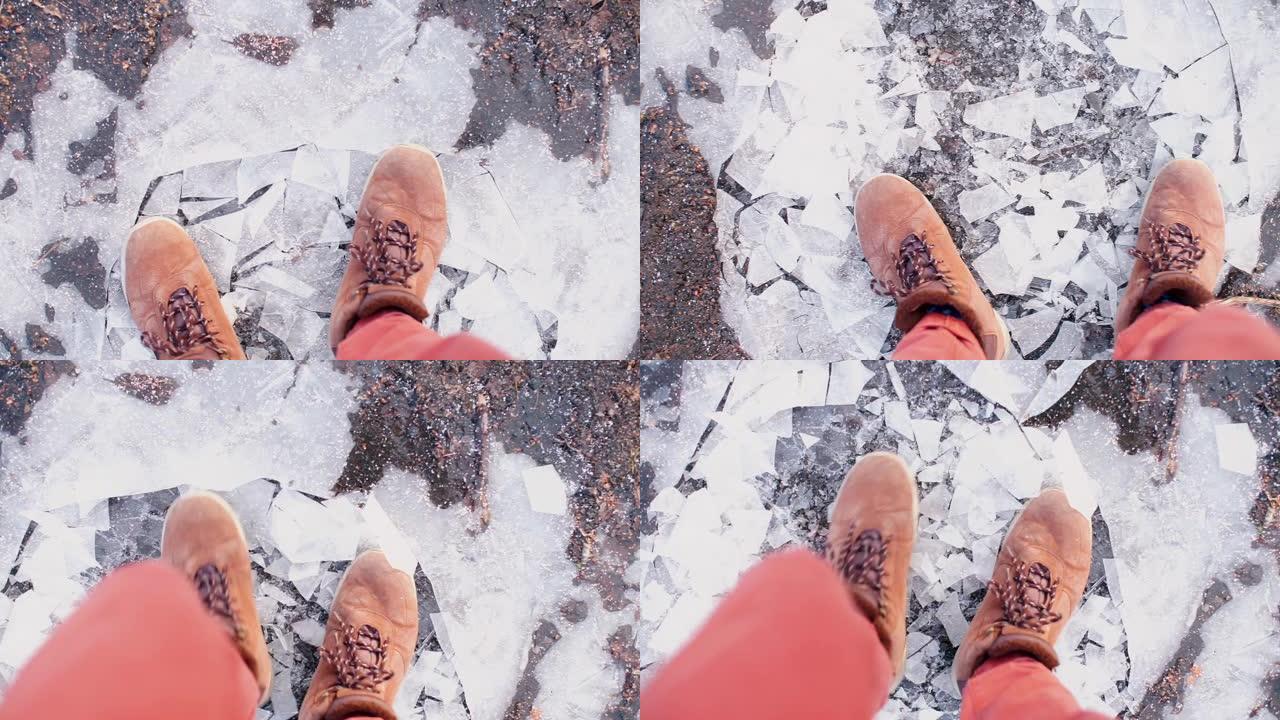 冬天，救生员穿着薄冰的靴子行走。