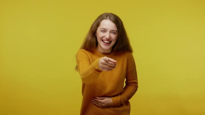 Amused happy girl with brown hair in pullover hold