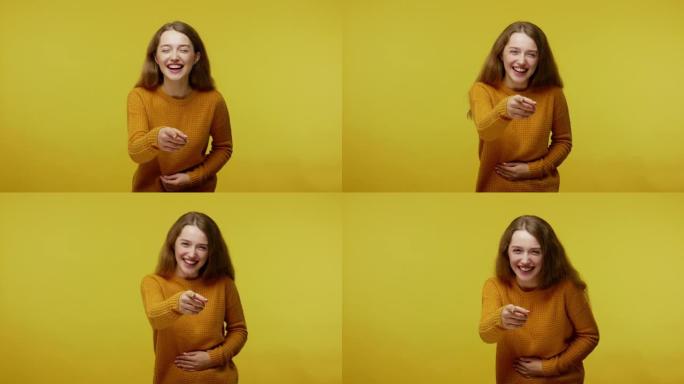 Amused happy girl with brown hair in pullover hold