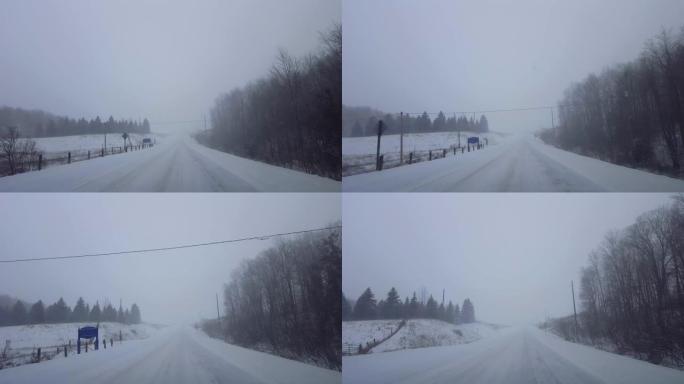 在冬季危险的路况下驾驶雪天气。司机的观点POV暴风雪在远处白雪皑皑。