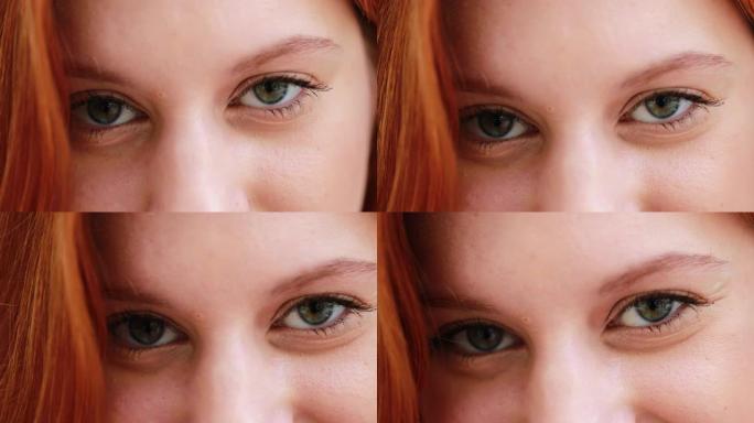 白人女孩睁开眼睛，绿色眼睛的年轻红发女人的特写镜头