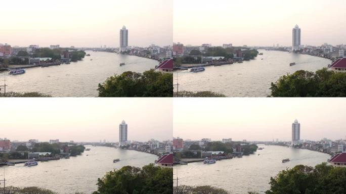 泰国曼谷，日落时分城市景观和河流的鸟瞰图。