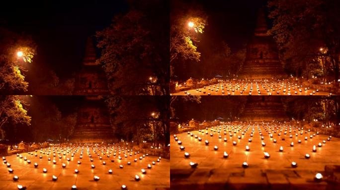佛教点燃了古庙周围的蜡烛小径