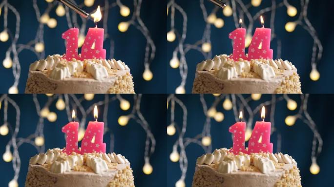 蓝色背景上有14号粉色蜡烛的生日蛋糕。蜡烛着火了。慢动作和特写视图