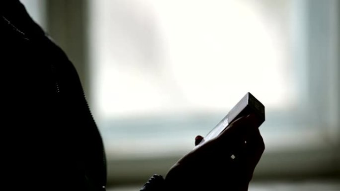 Close-up of the silhouette of female hands opening