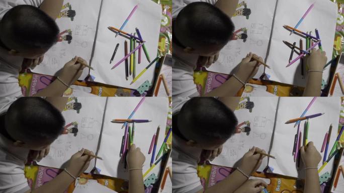 亚洲孩子画画和做作业