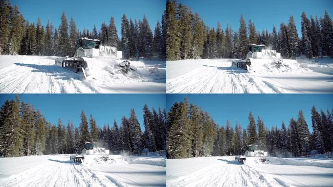 雪猫美容机卡车的手持镜头经过并在雪地中保持户外步道