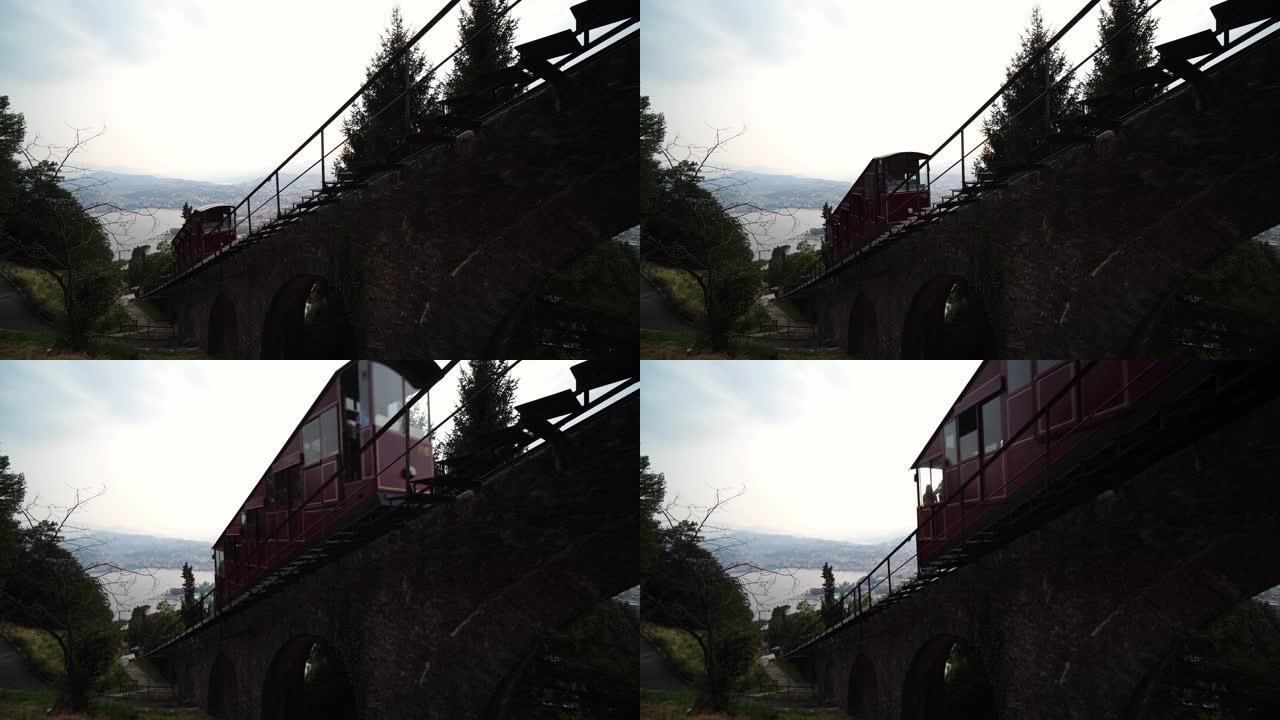 开往蒙特布雷山的缆车列车。卢加诺湖全景。提契诺州瑞士。
