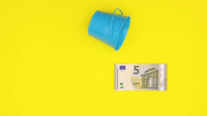 水滴落下时欧元纸币的变化和价值的增长-停止运动