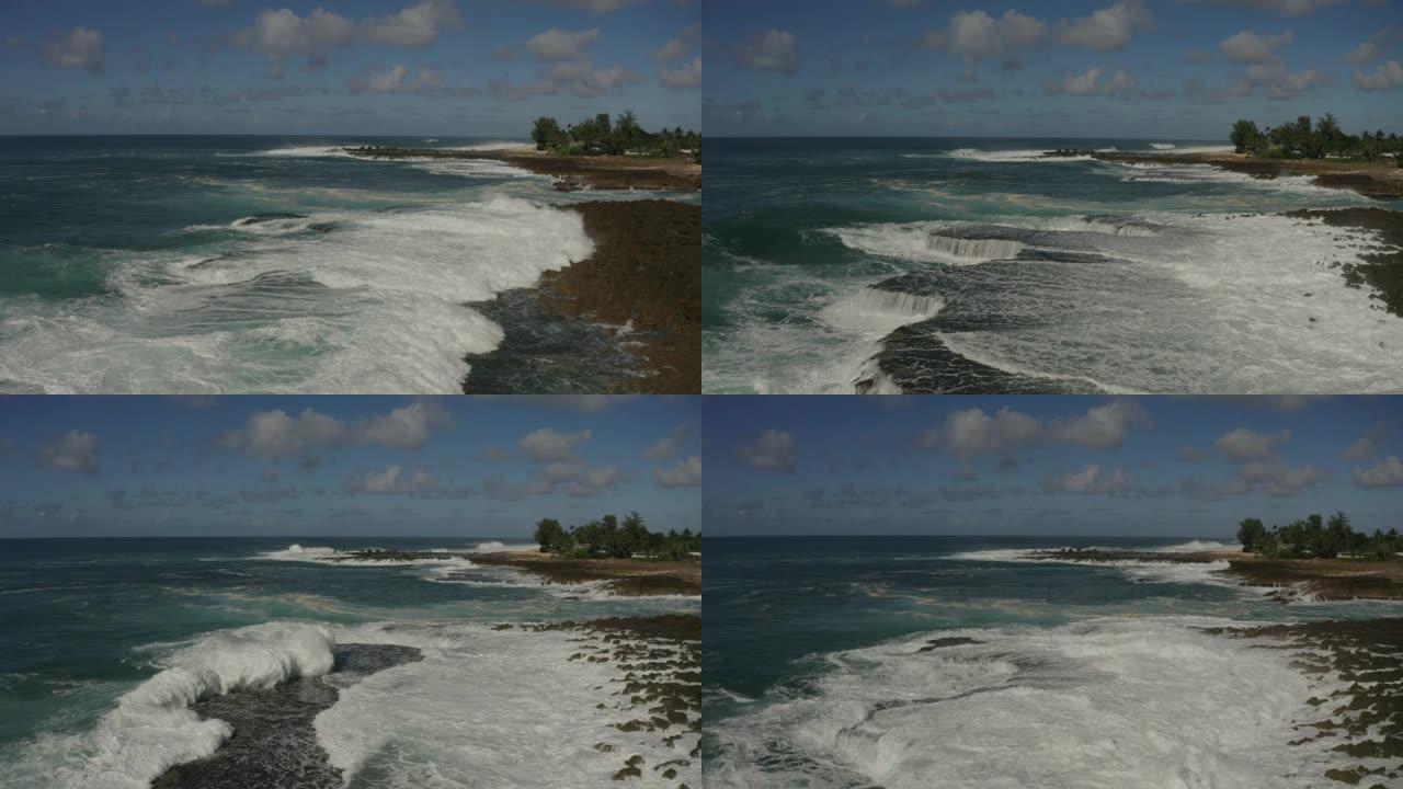 太平洋汹涌的海浪冲入瓦胡岛多岩石的海岸线