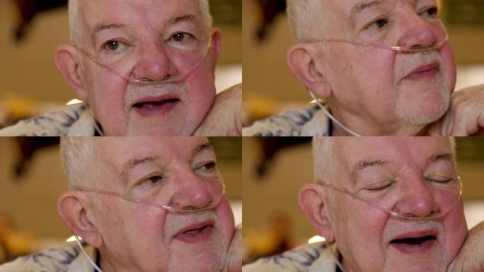 一名戴着鼻氧气管的老年男子的肖像