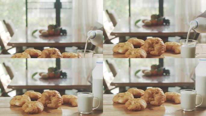 餐桌上有羊角面包和牛奶的早晨场景