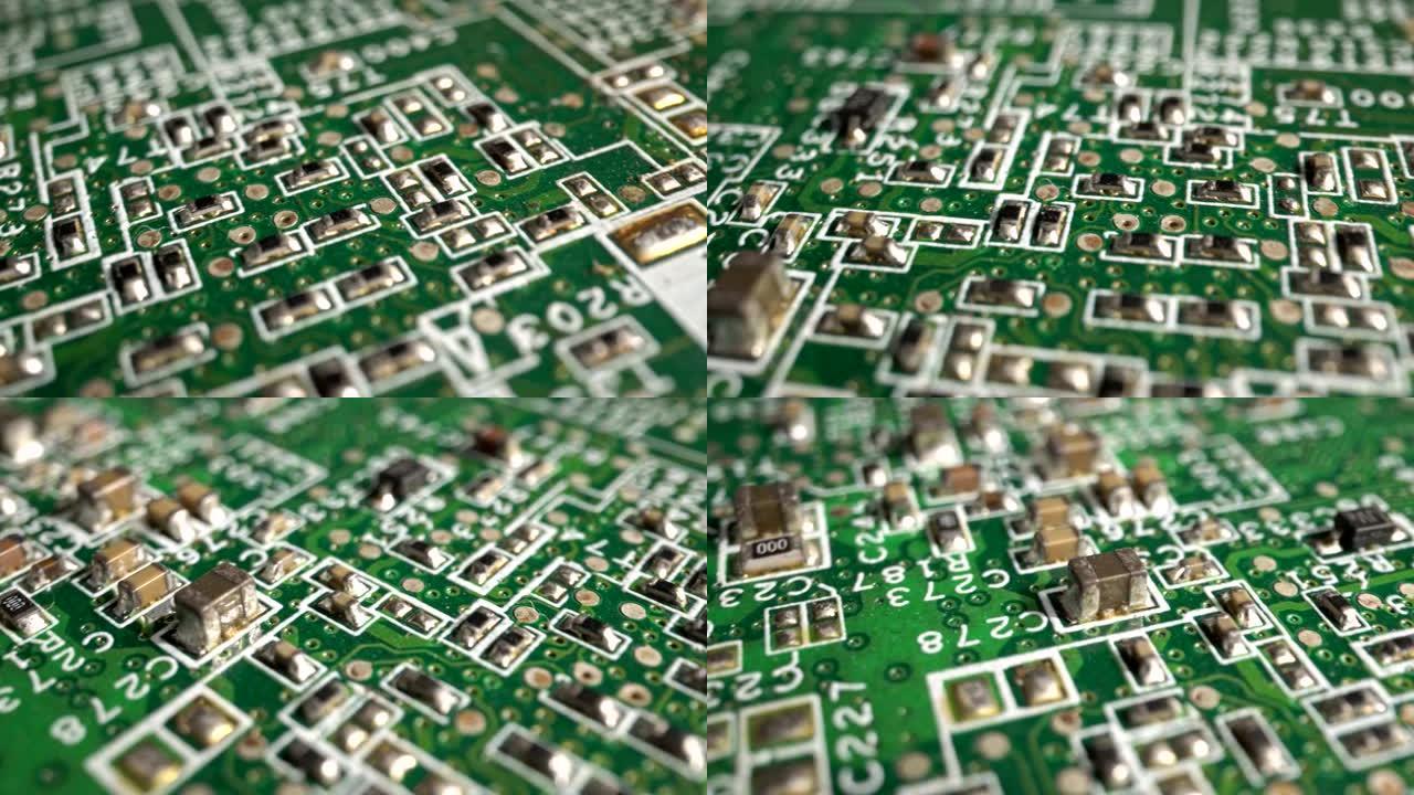 用多莉拍摄的绿色印刷电路板电子产品的极端特写