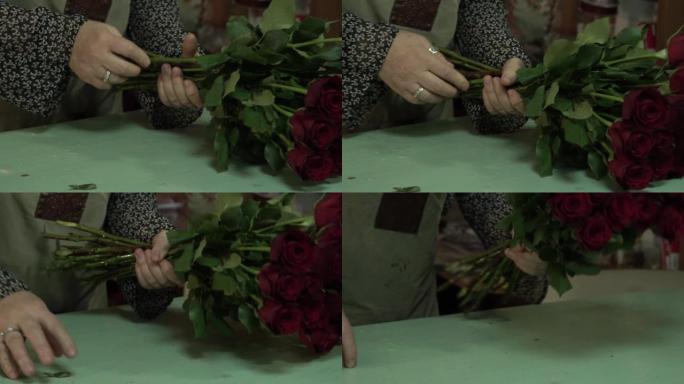 花店加工并制作了一束猩红色的栗色玫瑰