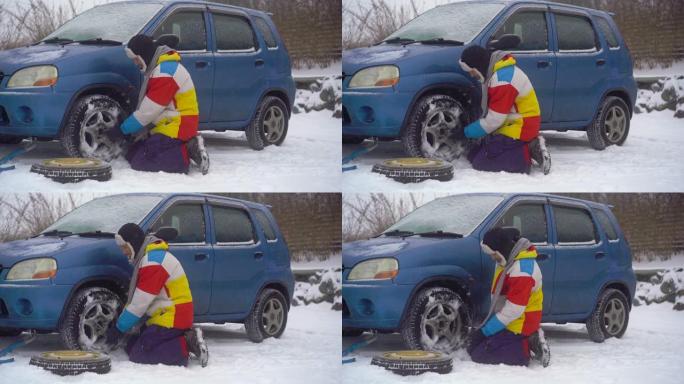 冬天，飘着雪。路上的人的车有问题。他正试图更换车轮，但他不能，然后他打电话给道路援助公司寻求帮助