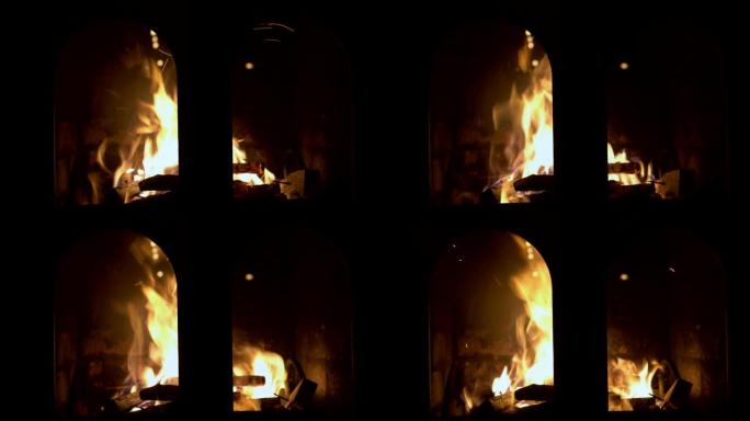 壁炉紧闭的玻璃门后面燃烧着一道强烈而明亮的火。背景模糊。没有人开枪。概念。特写。4K