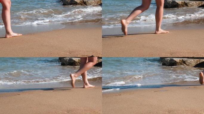 苗条女人的腿在黄沙上沿着大海行走。沙滩上晒黑的腿。年轻苗条的女孩沿着大海行走，在沙滩上留下脚印。