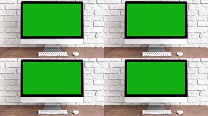 木桌上的键盘和鼠标模拟绿屏电脑桌面。带色度键的工作场所概念。