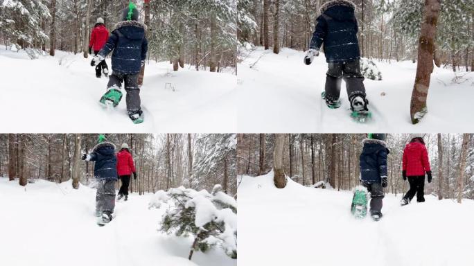 暴风雪过后，母亲和儿子在冬天在户外雪鞋行走