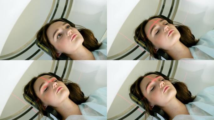一个美丽的女人躺在猫扫描的特写镜头。床在机器内移动，扫描女性大脑。现代医院的计算机断层扫描。医疗诊所