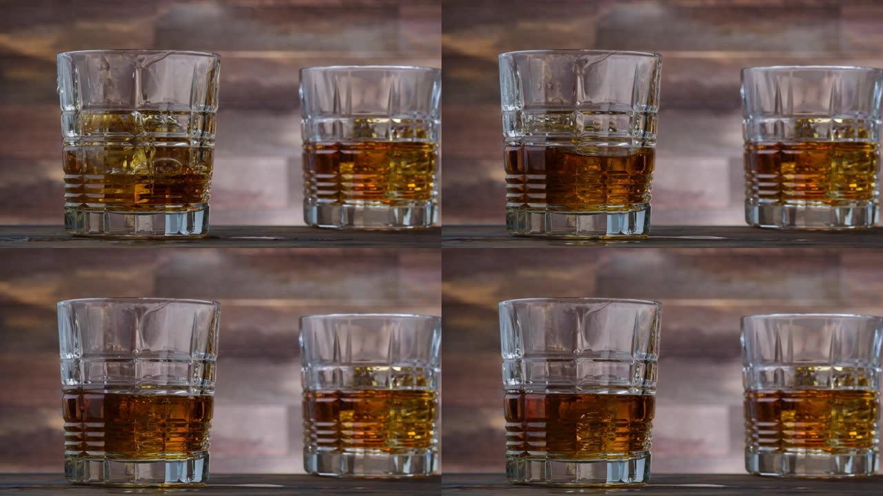 冰块掉落在玻璃杯中，配以金色威士忌和飞溅的酒精