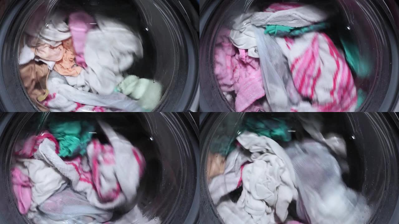 洗衣服特写。洗衣机的滚筒转动，卫生，洗衣