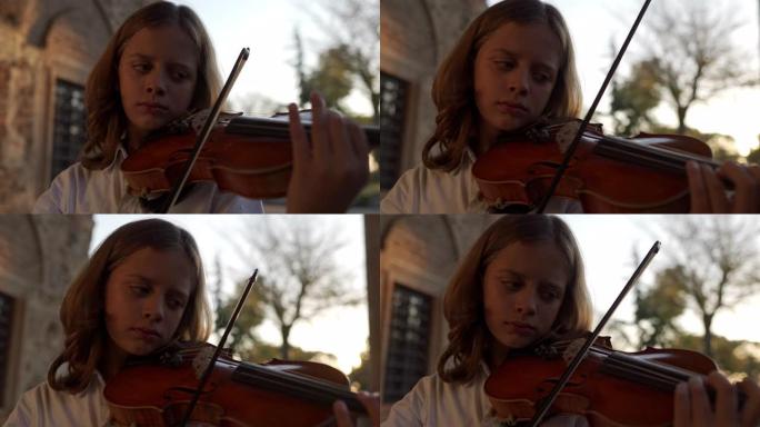 一位年轻小提琴家在纪念碑前演奏的特写视频