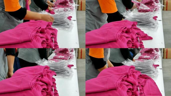 纺织服装厂整理衣物生产车间衣服打包折叠衣
