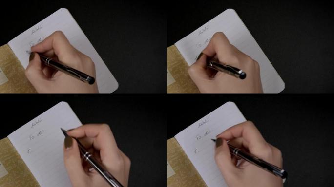 女性双手用铅笔写字在空白条纹笔记本上做列表编号2020，提醒概念。规划2020
