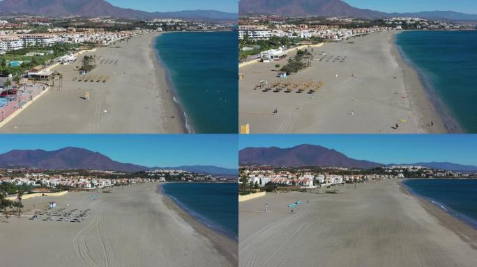 带芦苇伞的沙滩鸟瞰图。西班牙