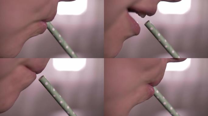 女人用吸管喝苏打水，特写镜头