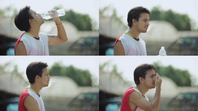 慢动作运动亚洲男子户外锻炼后喝水