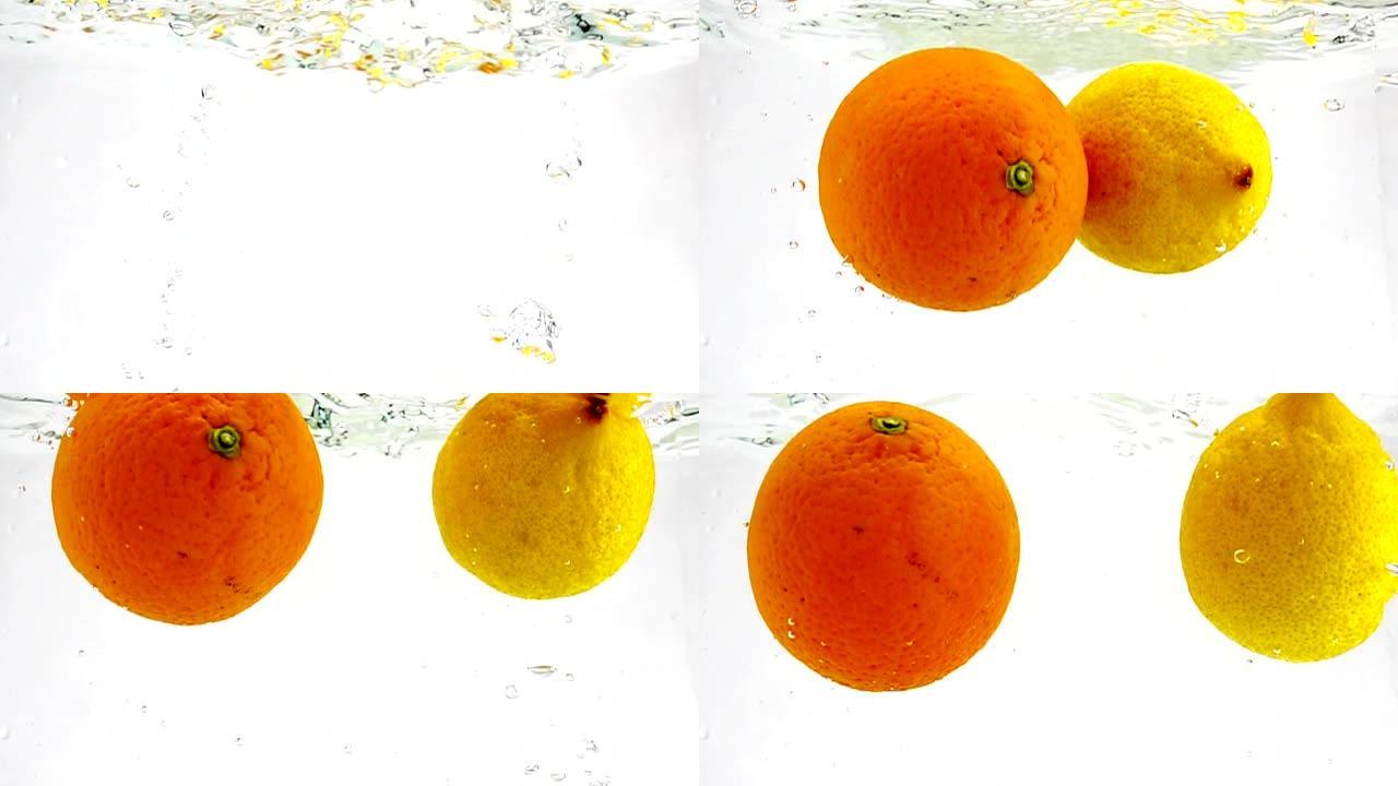 多汁的橙子和柠檬随着气泡落入水中。在孤立的白色背景上慢动作的水果。