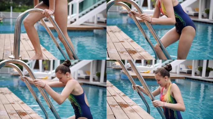 一个十几岁的女孩慢慢地从游泳池楼梯上走进冷水。
