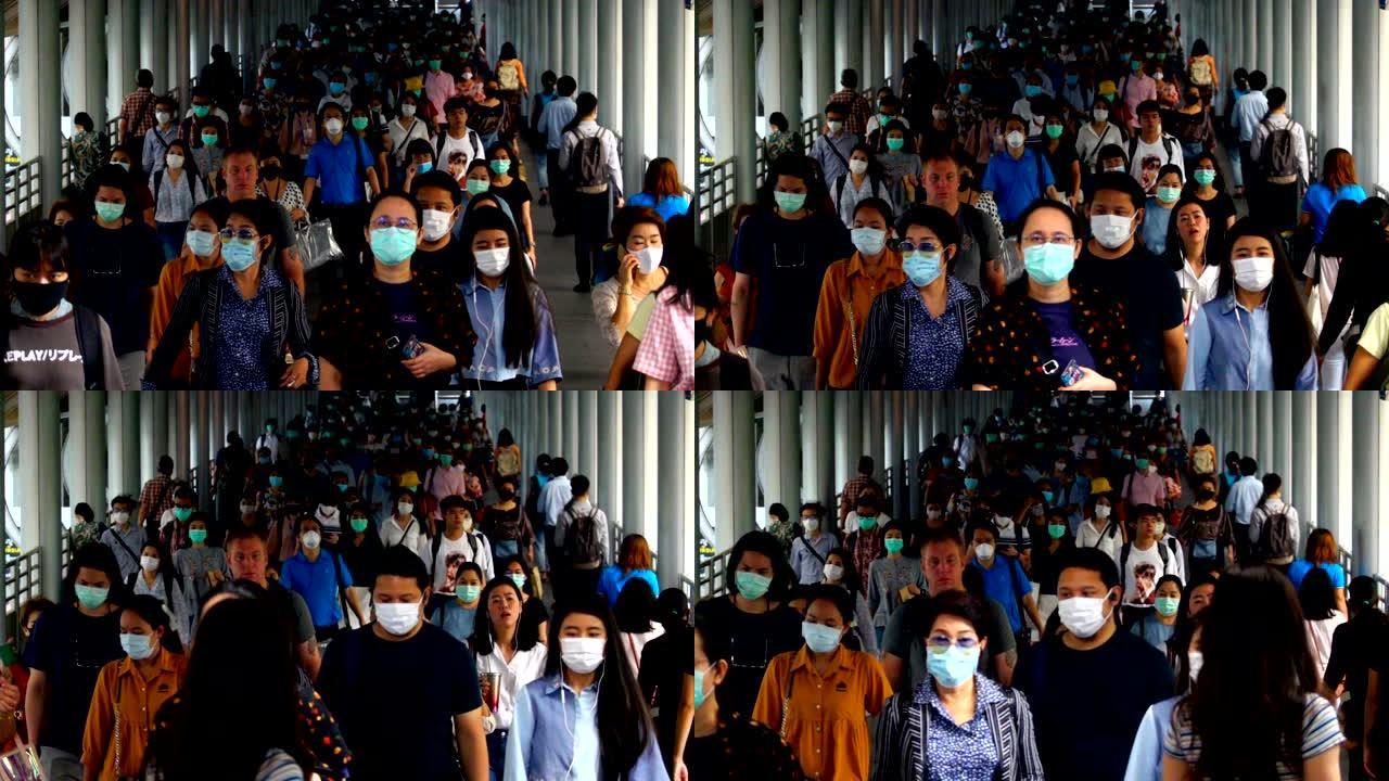 慢动作人群亚洲人在早上高峰时间去曼谷工作场所时戴着面部保护装置预防冠状病毒或新型冠状病毒肺炎和空气中