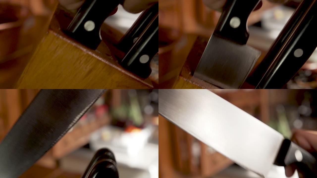 一只手从刀块中拉出厨师刀的极端特写