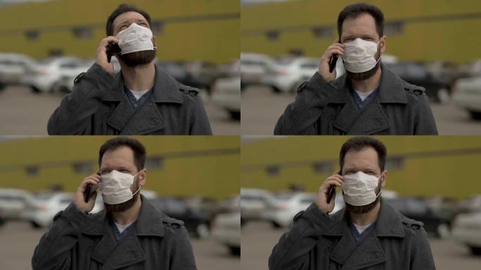 防止疾病和冠状病毒，一个戴着医用口罩的人在电话里说话