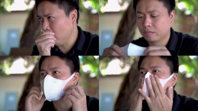 亚洲男子患有面罩保护咳嗽。
