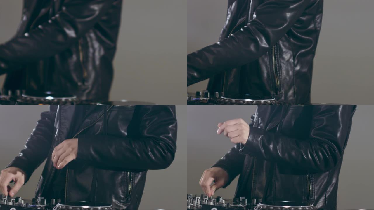 DJ跳舞并在混音台上使用控件