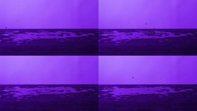 雨滴落在木桌上-紫色背景，慢动作