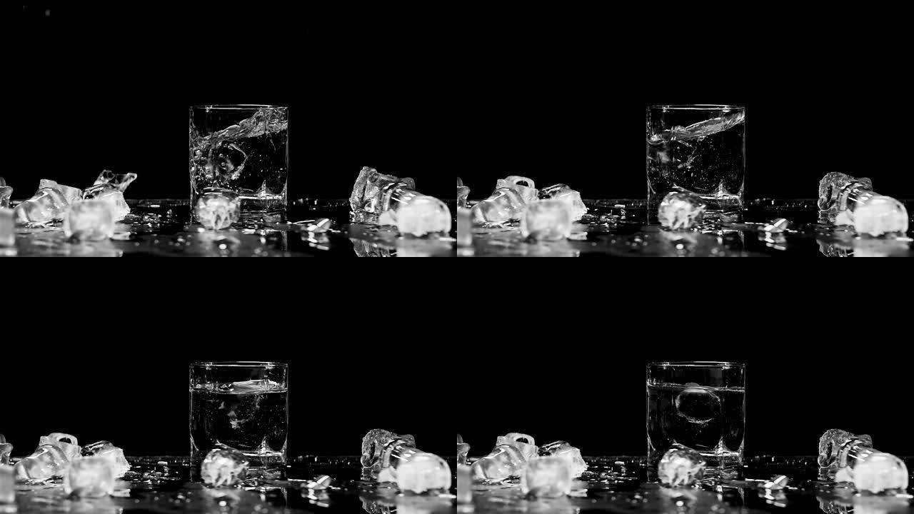 冰以超慢动作落入玻璃中。用电影相机红龙拍摄，240fps。特写慢动作黑白镜头，孤立背景
