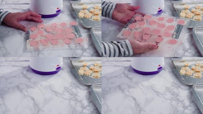 Pouring melted chocolate into a plastic chocolate 