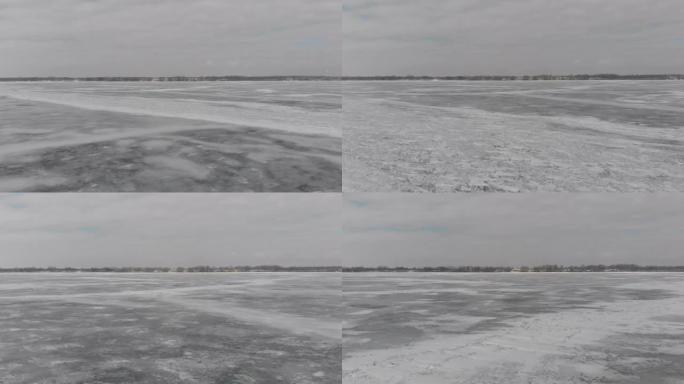 在冰冻的湖面上飞向海岸。