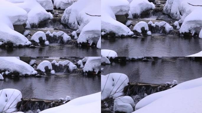 小瀑布流过雪地溪流溪水小溪