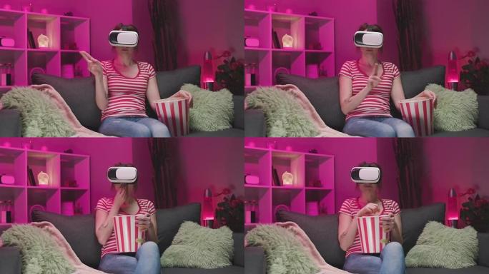 年轻女子晚上戴VR耳机和触摸虚拟屏幕