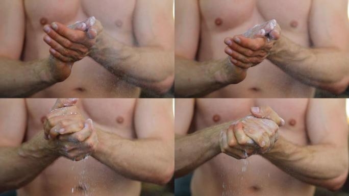 一个男人的手拍着粉笔的手的慢动作镜头