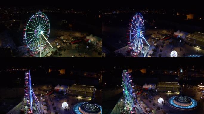 圣诞村瓦莱塔市摩天轮的空中俯视图。晚上，晚上。欧洲。马耳他国家